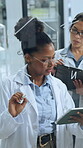 Scientist, tablet and woman writing on glass board in lab for formula, innovation or physics. Technology, solution and science team with talking for planning, equation and symbol for medical research