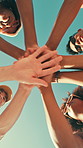 Friends, summer and stack hands with sky, celebration and bonding with care, connection and circle. People, group and low angle with pile, palm and excited with motivation for solidarity on holiday