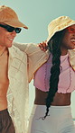 Summer, walking and friends hug on beach for vacation, holiday and weekend outdoor. Travel, social hangout and happy people embrace for bonding, relax or talking to enjoy adventure together by ocean