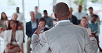 Back, business and man with speech for audience for conference, training and public speaking. Mature person, talking and staff listening to discussion, corporate event and lecture at learning seminar