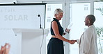 Business people, meeting and handshake with award in ceremony for achievement or promotion. Happy, employees or colleagues shaking hands with smile or trophy for accomplishment or well done on podium