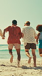 Running, group and tourists on holiday, beach and fun with friends on getaway, adventure and outdoor. Travel, back and people with energy on vacation, barefoot and together in nature, paradise or sea