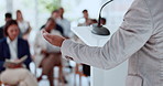 Business person, hands and back with podium for presentation, speech or tradeshow in seminar. Employee, speaker or discussion with audience, team or crowd for workshop or announcement in conference