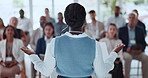 Back, business and woman with speech for audience for conference, training and upskill pitch. Female person, talking and staff listening to discussion, corporate event and lecture at learning seminar