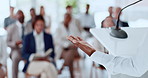 Business person, hands and back with presentation for speech, tradeshow or seminar on podium. Employee, speaker or discussion with audience, team or crowd for workshop or announcement in conference