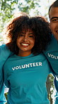 Teamwork, volunteer and face of people in park for charity event, community service and help. Flare, below and portrait of men and women for collaboration, support and solidarity for outreach program