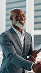 Mature man, handshake and meeting with introduction for corporate onboarding or partnership in city. Male person, employee or shaking hands with smile for company deal, negotiation or hiring in town