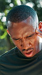 Outdoor, fitness and black man with headache, pain and stress with intense training. African person, migraine and runner in park, fatigue and tired with dehydration, exercise and injury with tension