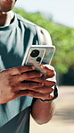 Hands, fitness and person with phone outdoor for health app, typing text or notification. Mobile, exercise and happy man in nature for online communication, training schedule or track performance