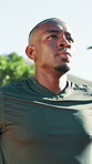 Outdoor, fitness and tired black man breathing for workout recovery, cardio endurance and wipe sweat. Person, fatigue and runner at park for rest, wellness and training challenge with sports break