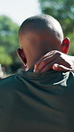 Neck pain, massage and back of man in park for exercise, workout and injury from training. Fitness, sports and person with tension, inflammation and muscle sprain for accident, recovery and outdoor