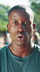 Face, runner and tired black man breathing for workout recovery, break and wind with bokeh. Fitness, fatigue and person outdoor for rest, wellness and determination for challenge with portrait