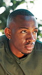Tired, athlete and black man relax in nature from fitness, exercise and recovery of cardio training. Male person, sweating and breathe for sports break, runner rest and fatigue of endurance challenge