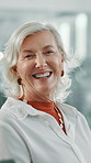 Mature woman, face and happy at startup in office for pride, excited or confident at media company. Person, portrait and writer with smile, career and laugh in workplace at creative agency in Spain