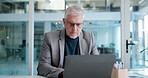 Glasses, laptop and mature business man in office for vision, reading email or investment report. Computer, spectacles and serious advisor with research, financial update and eyesight correction