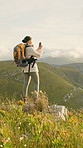 Woman, hiking photography of mountain with phone for social media post, travel and adventure. Space, person on hill with tech for picture, online nature blog and mobile app to document memories.