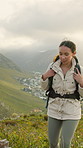 Woman, hiking and backpack on mountain for travel, fitness adventure and holiday challenge. Female person, walking and trekking gear to explore nature, backpacking hill and fresh air on vacation trip
