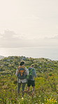 Back, friends or hiking on mountain for travel adventure, scenic sightseeing or bonding together. Space, backpack or people trekking in nature for tourist exploration, ocean view or wellness journey.