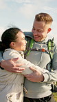 Hiking, couple and people outdoor with hug, bonding together and romance in sightseeing adventure. Love, happy man and woman in nature with embrace, connection and commitment in trekking trip.