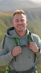 Backpack, face and hiking with man outdoor in nature for adventure, hobby or journey. Fresh air, tourism and trekking with happy hiker person in mountain location for break, trip or vacation