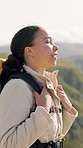 Backpack, breathing and hiking with woman outdoor in mountains for adventure, hobby or journey. Break, trekking and wellness with happy hiker person in nature location for fresh air, tourism or trip
