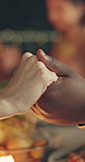 Holding hands, dinner and prayer with people, closeup and social gathering with faith. Home, group and friends with worship, event and gratitude with celebration, spiritual and thankful with food