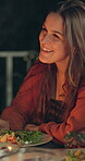 Night, woman and laughing at dinner outdoor for funny conversation, social gathering and bonding. Food, friends and lunch on patio with comic story, reunion celebration and new years party with bokeh