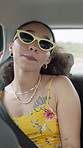 Singing, travel and woman with sunglasses, journey or vacation with happiness. Vehicle, celebration or person with transportation, karaoke or summer holiday with break, adventure, shades or road trip