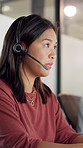 Woman, headset and typing at call center in office, night or feedback with talk for lead generation. People, consultant and agent with mic, insight and sales review in dark workplace at company