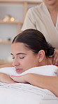 Woman, relax and back massage at spa for stress relief, muscle healing and luxury skincare. Person, masseuse and pamper with body therapy, tension treatment and soothing session for customer wellness