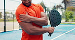 Exercise, padel and shoulder pain with man on court for competition event, game or tournament. Fitness, joint injury and sports with athlete outdoor at venue for condition, fatigue or training risk