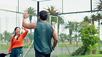Winner, padel and high five with people on court for competition training, contest score or fitness. Challenge achievement, tennis player and target with team on outdoor turf for match and tournament