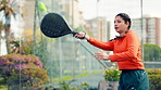 Padel tennis, woman and energy with serve on court for fitness, training and performance. Game, cardio workout or club competition with person in match for athlete, exercise and racket tournament