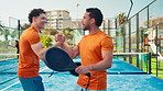 Padel, men and handshake on court for teamwork, competition success and hug. Tennis player, fitness and celebration outdoor for sports, shaking hands and support with embrace for winning game