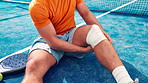 Bandage, knee pain and man on padel court with injury, medical crisis and accident outdoors. Fitness, health and person with ache, strain and hurt from training, workout and exercise for tennis game