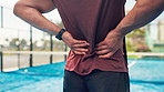 Man, hands and back pain with sport injury on padel court for ache, joint inflammation or strain. Active, male person or sore spine with muscle tension or pressure for accident, match or outdoor game