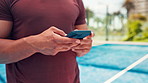 Padel, phone and hands on court for sport, typing text or  social media post on internet. Mobile, tennis player and man with online app for fitness, communication and check exercise schedule outdoor