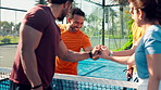 Sport, padel team and fist bump on court for tournament practice, healthy competition and friendly game. Happy people, tennis player and sportsmanship outdoor for fitness challenge and start match