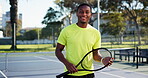 Tennis, face and man with racket on court for tournament practice, fitness workout or game training. Sport athlete, black person and happy at health club for playing competition and match confidence