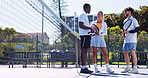 People, tennis court and discussion with friends in nature for game, competition or match together. Group, players or athletes with smile or racket for conversation, sport or chat on outdoor turf