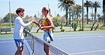 Sport, tennis and people with handshake on court for respect, sportsmanship and end of match. Racket, players and shaking hands with opponent at health club for friendly game or well done for contest