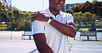 Black man, tennis player or shoulder pain with injury for muscle tension, sprain or strain on court. Active, male person or sore arm with ache for joint inflammation, pressure or accident on turf