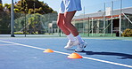 Fitness, feet and cones with agility practice on tennis court for match speed, coordination or health. Athlete, woman and footwork drills outdoor for sports endurance, tournament exercise and running
