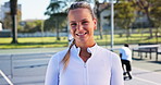 Face, athlete and woman with smile, tennis court and confident for tournament, fitness and wellness. Outdoor, happy and person with pride for sport competition, practice and preparing for game in USA