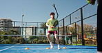 Padel, coach and person on court with cones for practice, exercise and training for competition. Sports, personal trainer and man with equipment for fitness, routine and workout for match or game