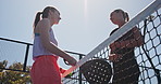 Women, discussion and padel tennis with net for match start, begin or ready for sport on court. Female people, friends or players in conversation for fitness challenge, training or outdoor practice