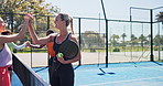 Padel court, sports game and women with high five, wellness and competition with support. People, tennis players and friends with training, contest and gesture with fitness, athlete and challenge