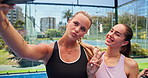 Happy women, padel tennis and court with selfie for memory, photography or picture together. Active, female people or friends with smile or peace sign for capture moment, sport game or match on turf