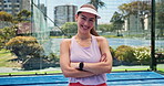 Padel court, face and woman with arms crossed, training and recreation with fitness. Tennis player, outdoor and healthy person with pride, hobby and smile with sports game, practice and athlete