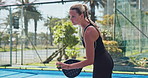 Padel, sports and woman on court for exercise, practice and training for competition, match and game. Sports, fitness and athlete with equipment outdoor for hobby, workout or challenge for tournament